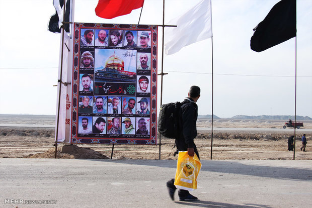 شور حماسه حسینی در کربلا با تصاویر شهدای حشدالشعبی و مدافعان حرم