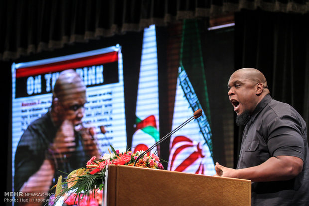 Amir Suleiman, American Muslim poet, addressing the opening ceremony. 