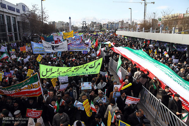 People in Qom, Mashad celebrate Feb. 11 anniversary