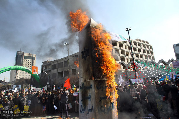 People in Qom, Mashad celebrate Feb. 11 anniversary