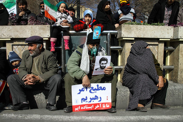 People in Qom, Mashad celebrate Feb. 11 anniversary