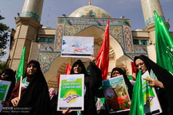 Iranian women rally to promote hijab
