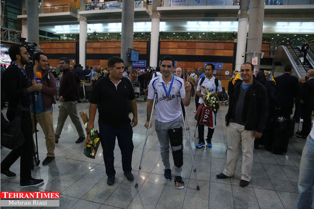 Iran futsal team returns home after finishing third at FIFA World Cup