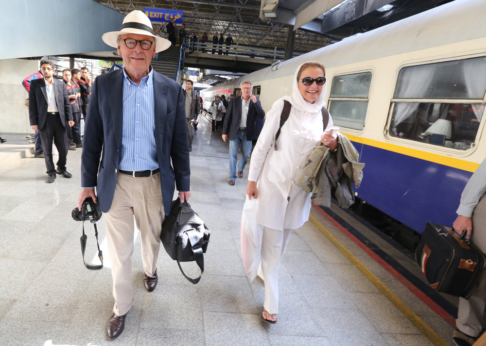 Tourists arrive in Tehran on a luxury train from Budapest