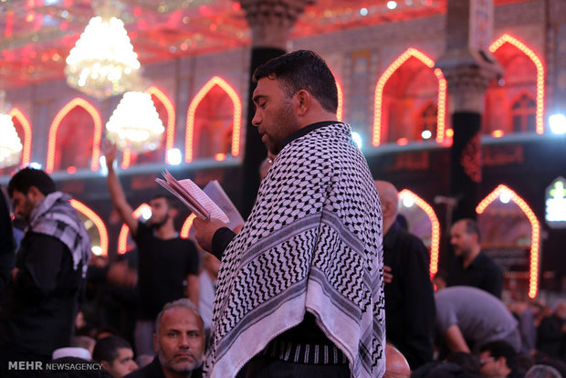 Karbala; Shrine of Imam Hussein embraced by swarms of pilgrims