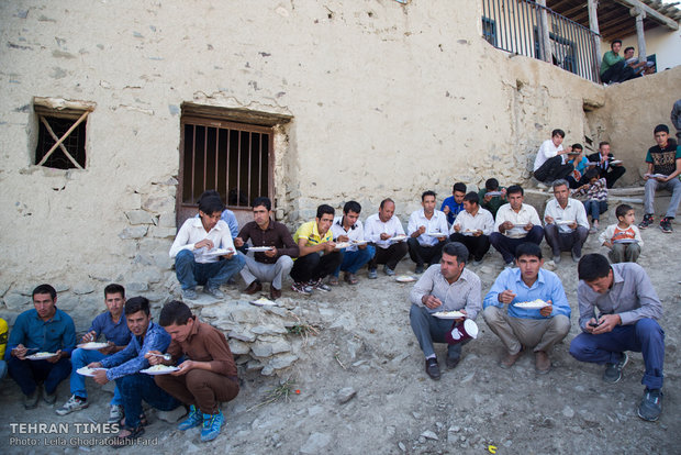 The wedding launch when men are eating outside and women inside.