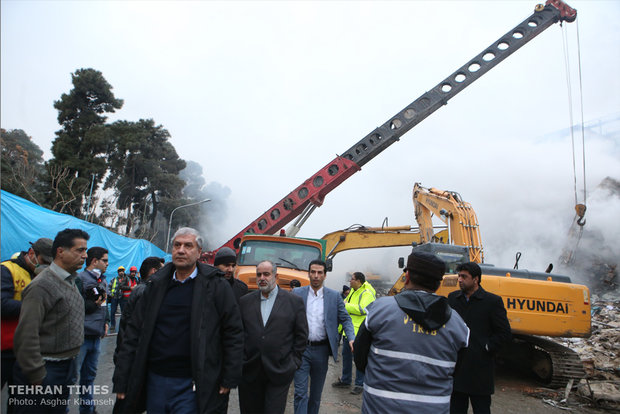 Rouhani visits building collapse site