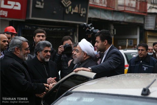 Rouhani visits building collapse site