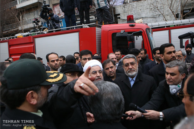 Rouhani visits building collapse site