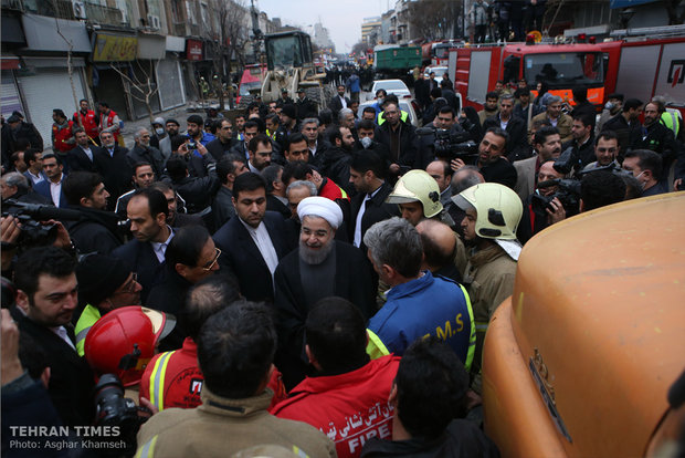 Rouhani visits building collapse site