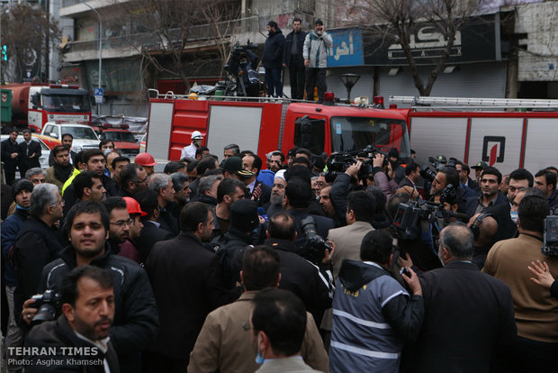 Rouhani visits building collapse site