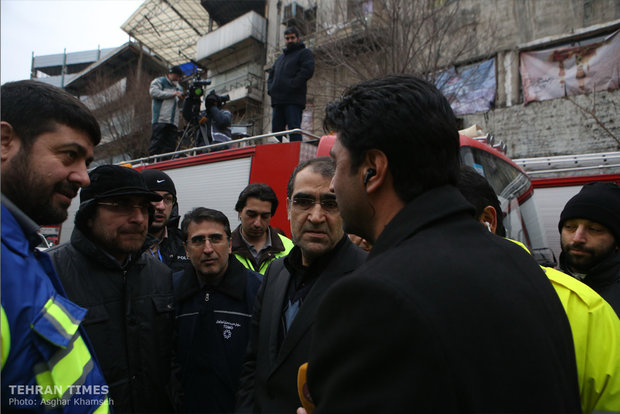 Rouhani visits building collapse site