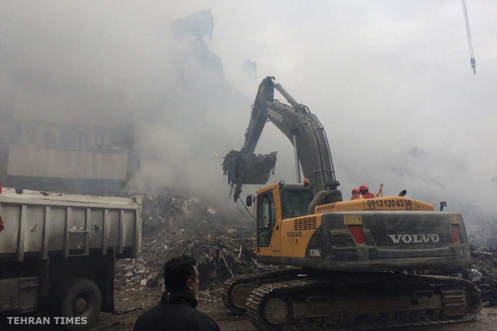 Plasco still in smoke with bodies trapped in it