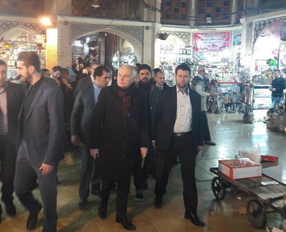 French Foreign Minister Jean-Marc Ayrault pays a visit to the historical grand bazaar in downtown Tehran on February 1, 2017.