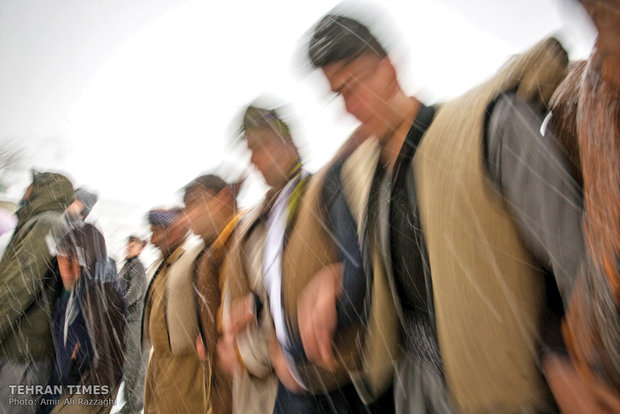 Men dancing together signifies their unity and solidarity.