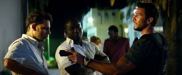 Peyman Moaadi (L), Pablo Schreiber (R) and Shane Rowe act in a scene from “13 Hours”