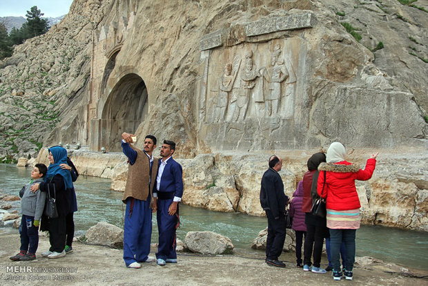 Tourists visit Taq Bostan in Kermanshah during Nowruz holidays 