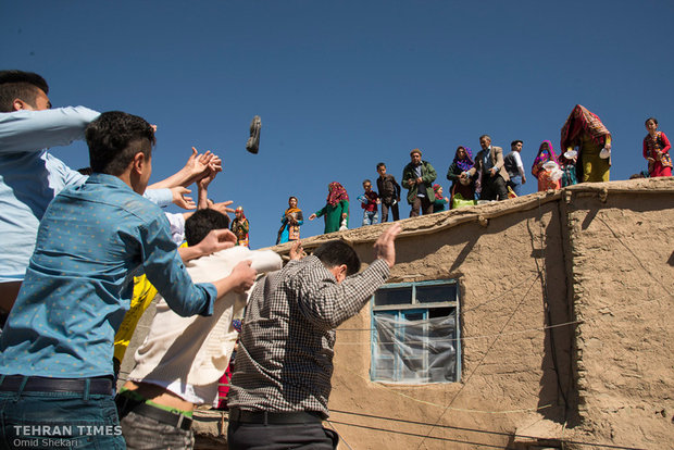 Single men of the village try to catch a shoe thrown from the roof by groom’s family. Anyone who catches the shoe receives a reward while returning it to groom’s family. Different items including balls, money, toys, and chocolate are thrown by groom’s family as a part of the wedding ceremony.