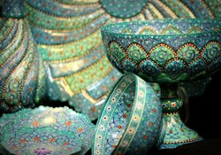 A patchwork of traditional Iranian vessels meticulously inlaid with enamel