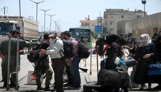 460 militants leave al-Waer neighborhood