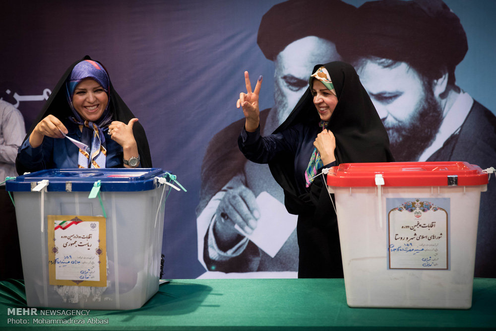 مشاهد من المشاركة في الانتخابات الرئاسية والمجالس البلدية في ايران