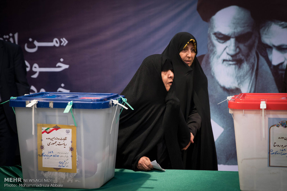 مشاهد من المشاركة في الانتخابات الرئاسية والمجالس البلدية في ايران