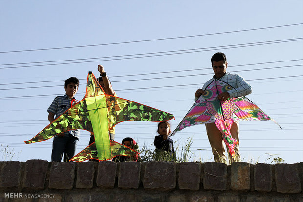 Children fly kites in Sanandaj festival of kites