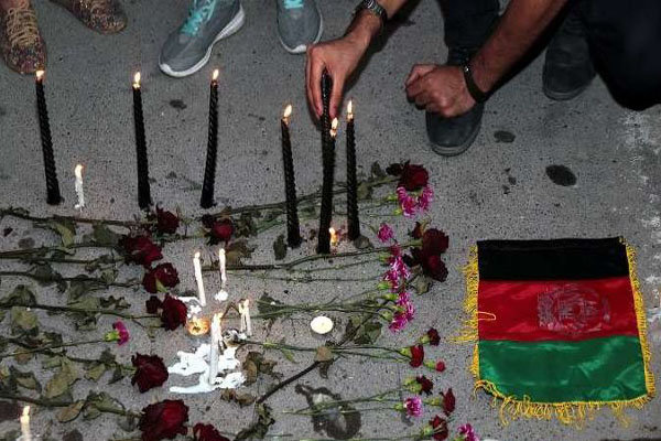 Iranians light candles at Consulate General of Afghanistan