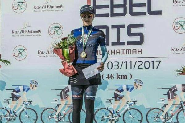 Female cyclist atop Jebel Jais Challenge