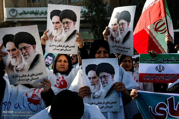 Iranians march streets to denounce riots