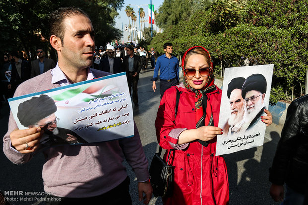 Iranians march streets to denounce riots