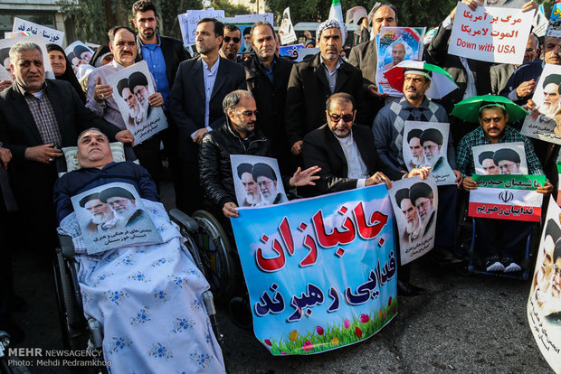 Iranians march streets to denounce riots