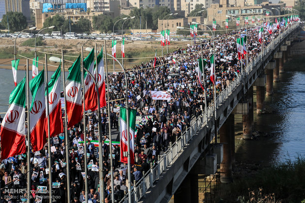 Iranians march streets to denounce riots