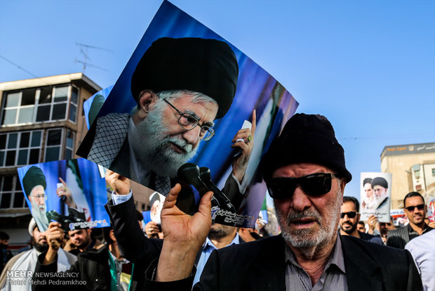 Iranians march streets to denounce riots