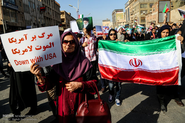 Iranians march streets to denounce riots