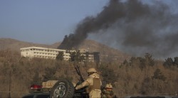 Smokes rises from the Intercontinental Hotel after an attack in Kabul, Afghanistan, Sun. Jan. 21, 2018. Gunmen stormed the hotel in the Afghan capital on Saturday evening, triggering a shootout with s