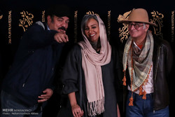 Director Kambuzia Partovi (R) and cast members Nasrin Moradi (C) and Saeid Aqakhani pose during a photocall for “Truck” at the Fajr Film Festival in Tehran on February 2, 2018. (Mehr/Mohammadreza Abba