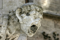 A gargoyle that has been damaged by acid rain