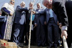 a ceremony for planting trees as a sign of friendship and peace with diplomatic delegations in attendance