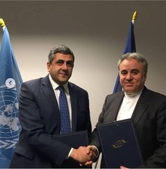  CHHTO deputy director Mohammad Moheb-Khodaei (R) and UNWTO chief Zurab Pololikashvili shake hands on March 8, 2018.