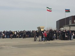 A crowd of passengers are seen at the Bileh Savar border crossing in Ardebil province, northwest Iran.