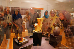 Foreign travelers look at historical relics on show at the National Museum of Iran, downtown Tehran.