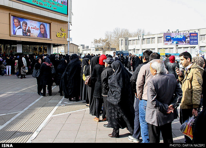 This file photo shows people in a queue to get into a theater in the northeastern Iranian city of Mashhad. (ISNA/Darya Nazeri)