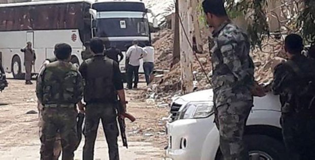 Buses carrying terrorists star to exit towns in southern Damascus
