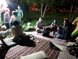 People have fled into the street after the quake hit Sisakht in the middle on the night