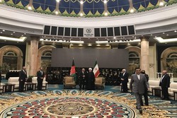 Iran, Afghanistan presidents meet in China