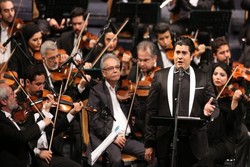Vocalist Salar Aqili performs a concert with the National Orchestra in an undated photo.