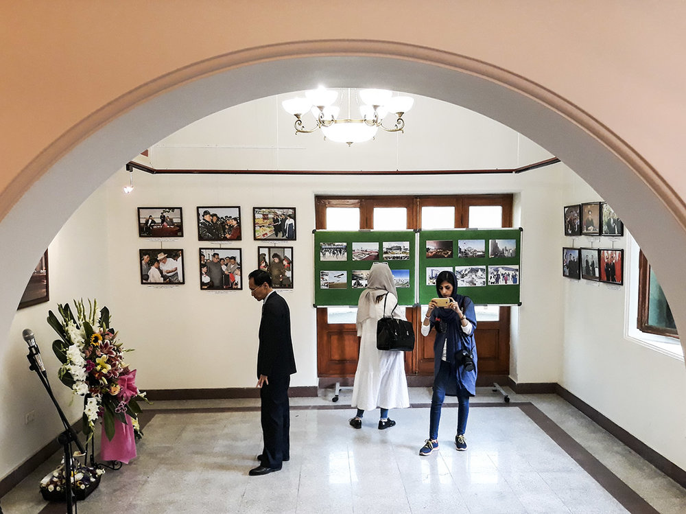Visitors are seen in an exhibition of photos of North Korea at the Palestine Museum of Contemporary Art in Tehran on July 2, 2018. (IRNA)