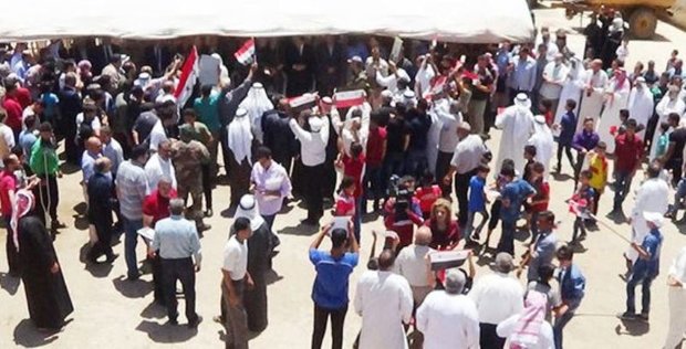 Locals of al-Kirk town in Daraa celebrate eliminating terrorism 