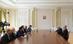 Iranian Health Minister Hassan Qazizadeh-Hashemi (4th L), and Azerbaijan President Ilham Aliyev (1st R)
